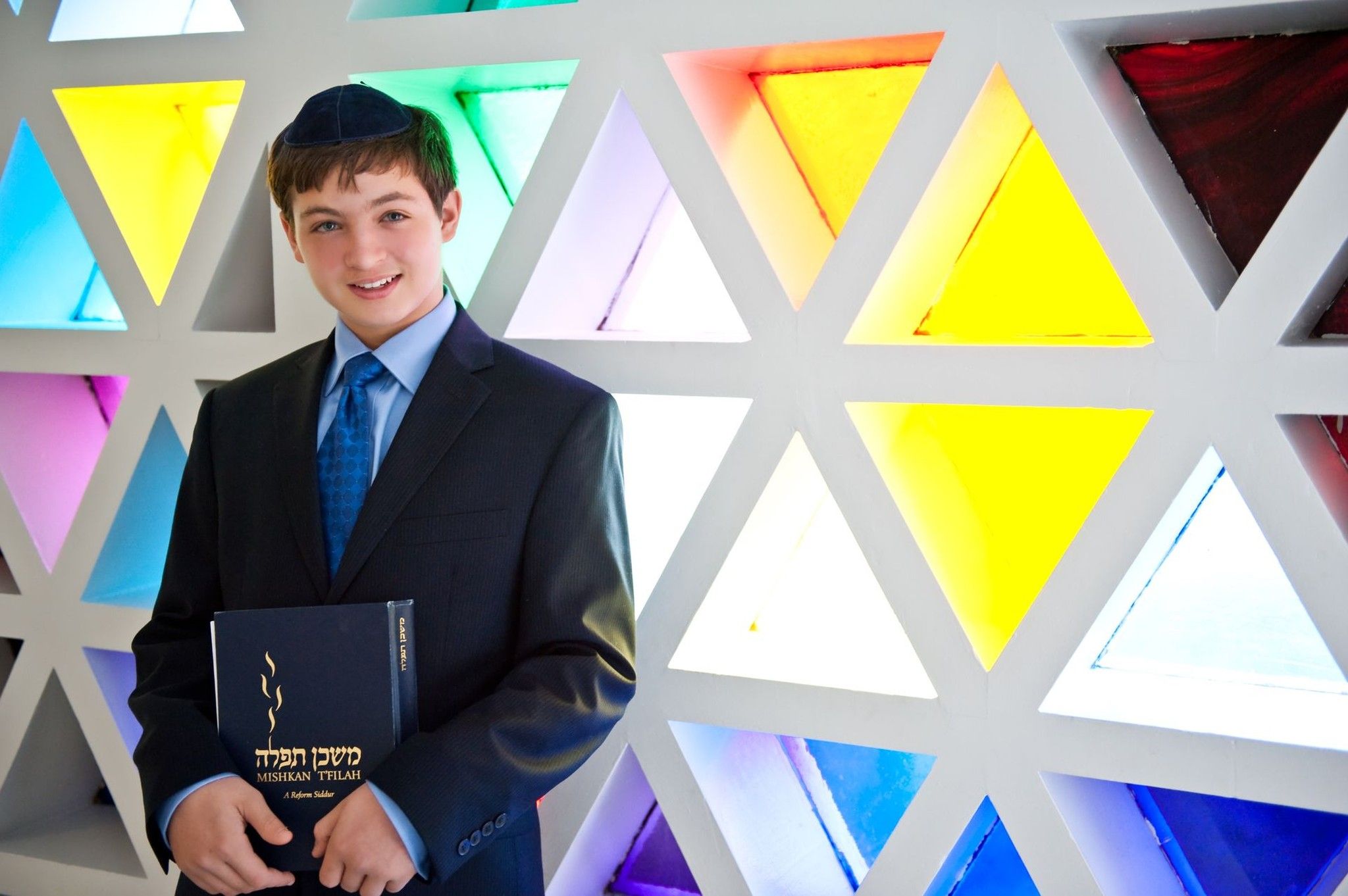 Bar mitzvah boy with prayer book