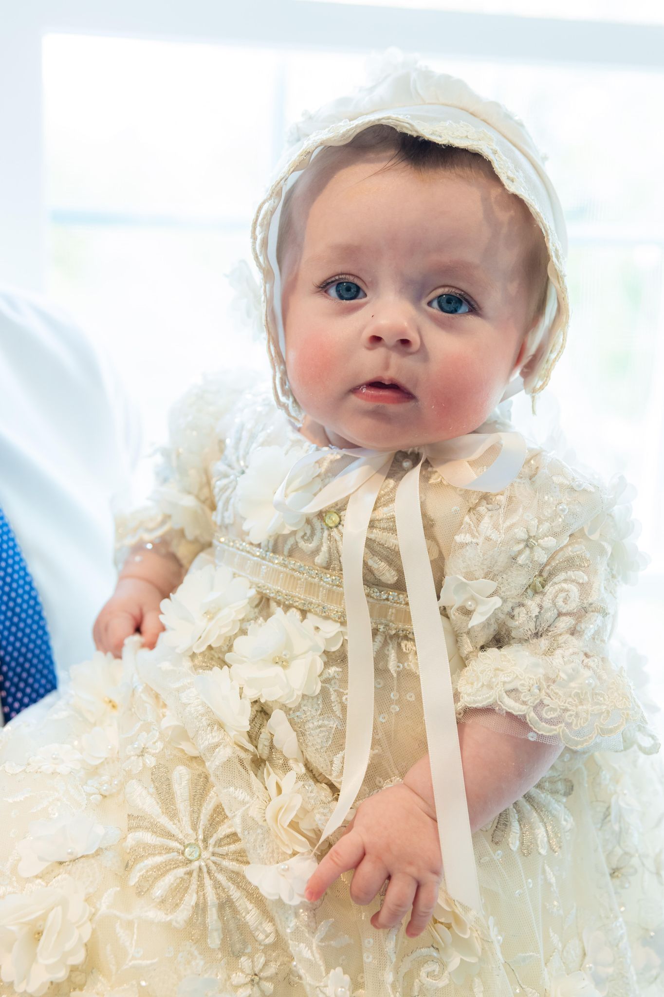 Baby in white baptism gown