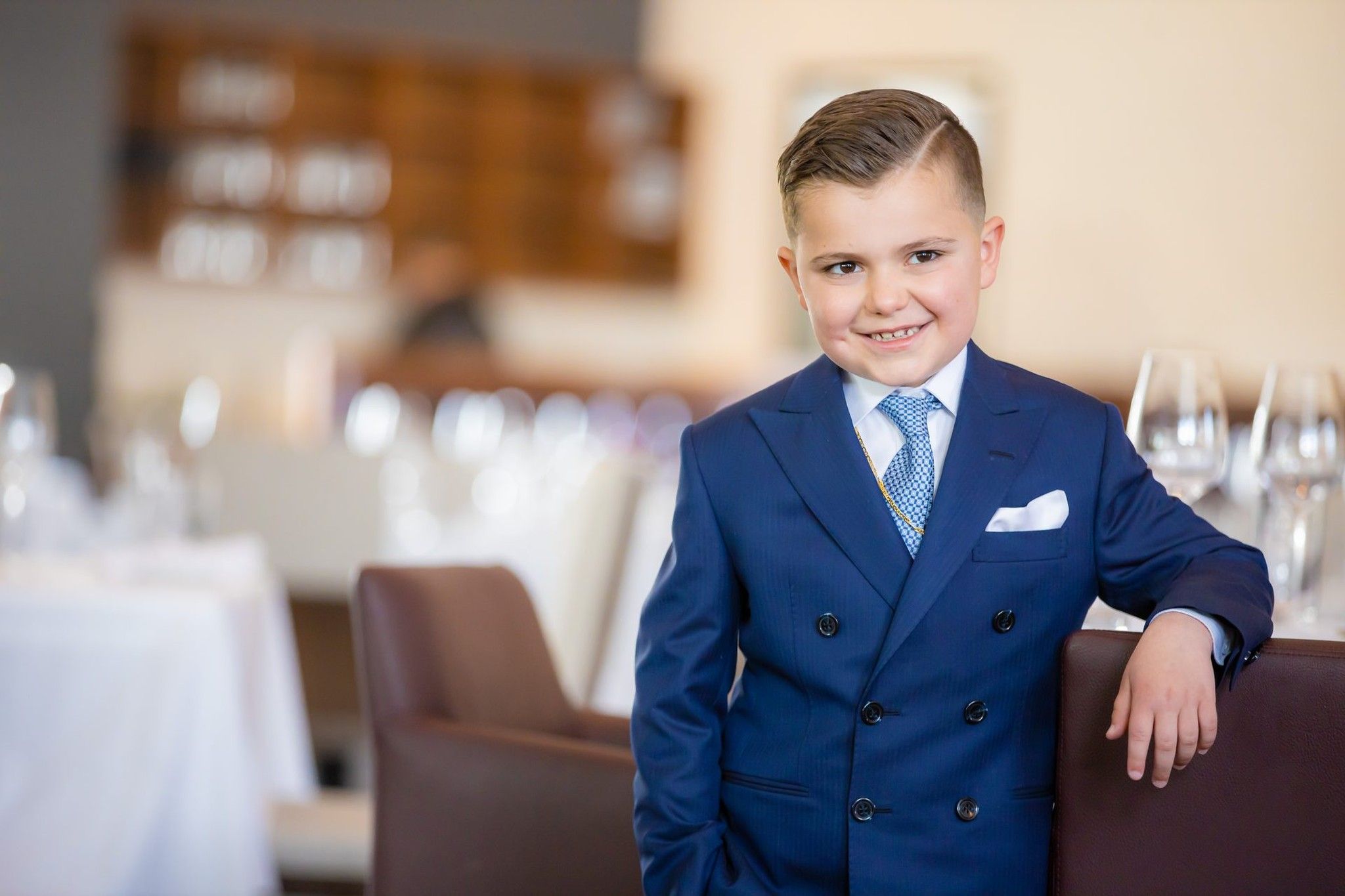 Boy in blue suit at communion