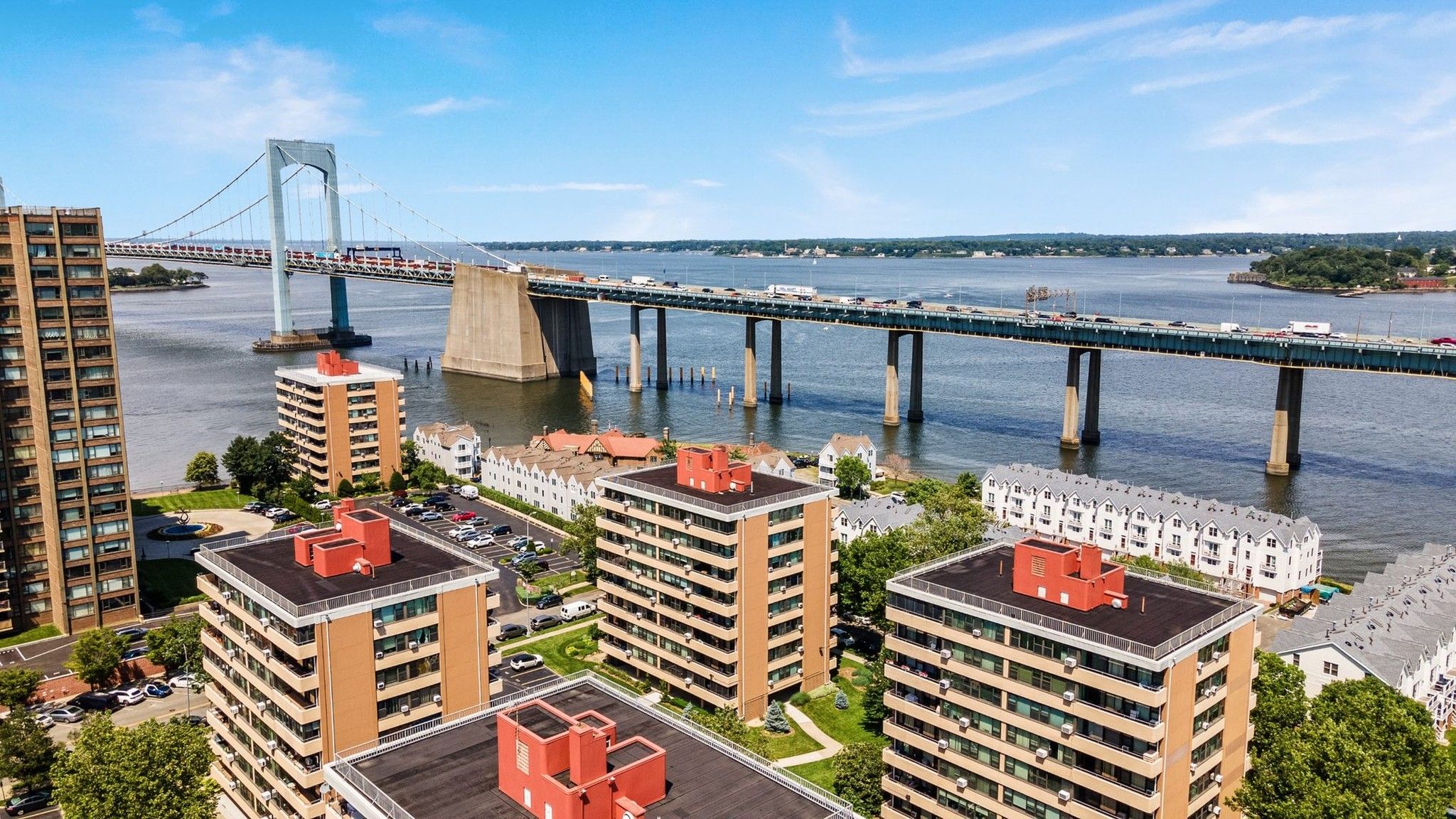 Aerial drone view of a bridge spanning a wide river